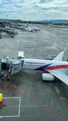 an airplane is parked at the airport terminal