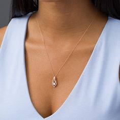 Add a sweet hint of glamour to your look with this multi-diamond infinity teardrop pendant in rose gold. Crafted in precious 10K rose gold This shimmering style features a round diamond composite at the center of a layered diamond-lined infinity symbol-shaped frame. This 1/3 ct. t.w. diamond teardrop pendant suspends along an 18.0-inch rope chain that secures with a spring-ring clasp. Infinity Symbol, Teardrop Pendant, Rope Chain, Spring Rings, Round Diamond, Round Diamonds, Rose Gold, Chain, Ring