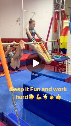 two girls are on the trampoline and one girl is holding onto an orange pole