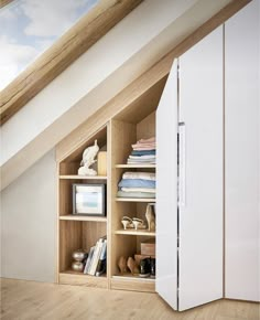 a white refrigerator freezer sitting inside of a wooden cabinet next to a book shelf