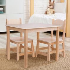 wooden kids table and chairs in a room