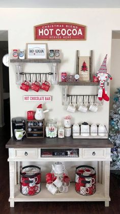 the coffee bar is decorated with red and white mugs, hot chocolate bars, and christmas decorations