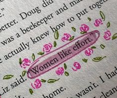 a close up of an open book with pink flowers on the page and words written in english