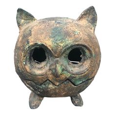 an odd looking metal object with big eyes