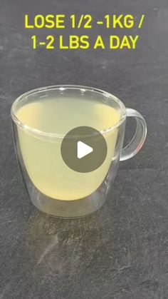 a cup filled with liquid sitting on top of a table