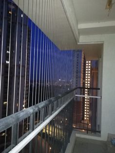 an empty balcony overlooking the city at night