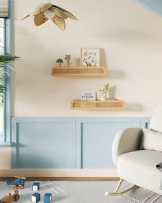 a white chair sitting in a living room next to a shelf filled with toy animals