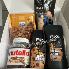 an open box containing nuts, chocolates, and other items for the nutella