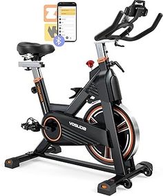 an exercise bike is shown with the app on it's screen and phone nearby