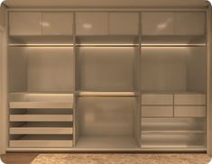 an empty walk in closet with white shelves and drawers