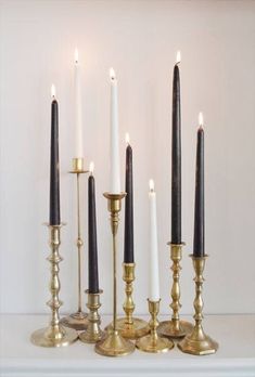 several candles are lined up next to each other