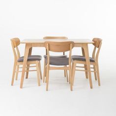 a wooden table with four chairs around it