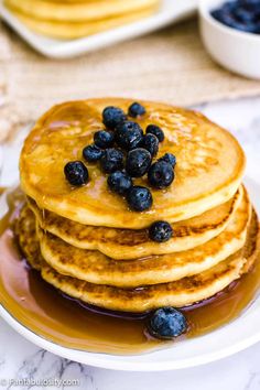 pancakes with blueberries and syrup on a plate