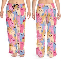 "An assortment of cuddly cartoon kitties print make these the coolest casual lounge pants. Pajamas for bedtime or just comfy casual pants for kicking back around the house.  100% polyester jersey knit fabric, along with the relaxed fit, makes for the ultimate comfort choice for casual pants at home. Meanwhile, the back elastic with the drawstring tie creates the perfect fit! 100% polyester - White seam thread - Light fabric (6 oz/yd² (203 g/m - Relaxed comfort fit - Back elastic and black drawstring tie - Sewn-in care label - Assembled in the USA from globally sourced parts  Purchase 6 or more items from our PicksPlaceGifts store and save 20-percent by using the coupon code \"20OFF6\" when checking out  cat mom pants,cartoon cats pattern,kitty cat pajamas,cute cats pajamas,artsy pajama bot Cartoon Kitty, Kitty Pattern, Mom Pants, Cat Pajamas, Fit Back, Polyester Pants, Sleep Pants, Sleep Shorts, Pink Pastel