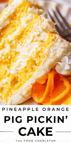 there is a piece of cake on the plate with oranges and whipped cream around it