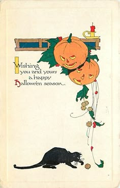 a halloween card with an image of a cat and pumpkins hanging from it's side