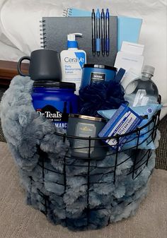 a basket filled with items sitting on top of a bed