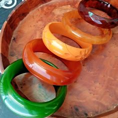 Elevate your style with this unique set of 5 Vintage Bakelite Phenolic Resin Bracelets 💫🌟 Add a touch of retro charm to your outfit! #VintageJewelry #BakeliteBracelets #VintageFashion #UniqueFinds #StatementJewelry  #Bakelite Cake Makeover, Garden Tools Design, Freelance Interior Designer, Tools Design, Bakelite Bracelets, 1960s Jewelry, Bakelite Jewelry, Bakelite Bangles, Resin Bracelet