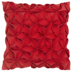 a red pillow that has been made out of paper flowers on the front and back