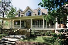 this is an image of a house with porches and steps to the front door