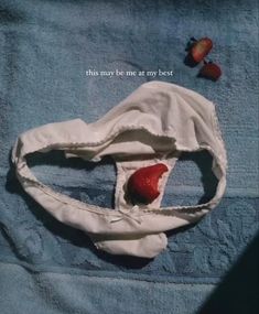 a towel with two strawberries on it and the words, this may be me at my best