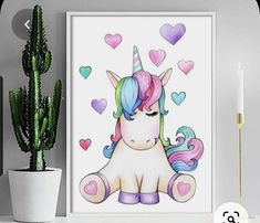 a painting of a pink and blue unicorn with hearts on it's face next to a cactus