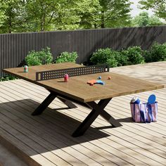 a ping pong table sitting on top of a wooden deck