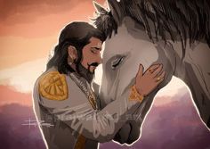 a man is hugging the face of a white horse in front of an orange sky