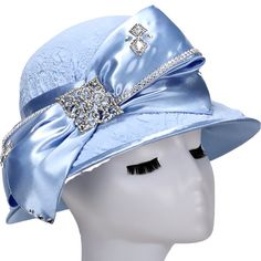 Giovanna Small Elegant Brim Hat Style: H0943 Color: Baby Blue Features stone embellishment & ribbons. Dimensions: Head Circumference 22.5” / Crown depth 4.75" / Brim width L:3", R: 1" / Diameter 10.5" Party Hat With Ribbon And Short Brim, Party Hats With Ribbon And Short Brim, Adjustable Blue Hats For Church, Blue Adjustable Hat For Church, Adjustable Blue Hat For Church, Adjustable Bow Hat For Church, Adjustable Blue Hat With Rhinestones, Blue Adjustable Hat With Rhinestones, Adjustable Blue Cloche Hat