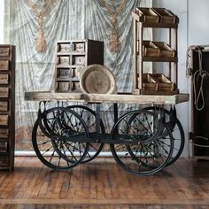 an old fashioned cart with many items on it