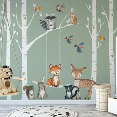 children's room with forest wallpaper and woodland animals on the swing, painted in green