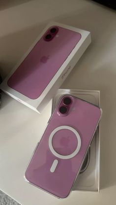 an iphone case with a magnifying glass on it sitting next to a box