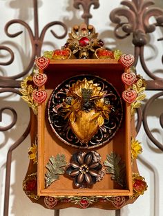 an ornate clock is hanging on the wall