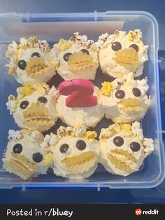 cupcakes in a plastic container with eyes on them