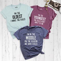 Siblings Shirts, Oldest Middle Youngest Shirts, Big Middle Little Shirt, Matching Siblings Outfits, Sister Birthday Shirt, Sibling Rules Tee Celebrate sibling bonds with our adorable Siblings Shirts and Oldest Middle Shirts or Youngest Shirt collection! Whether you're the Oldest, Middle, or Youngest, our fun and stylish Big Little Shirts are perfect for any occasion. These Matching Siblings Outfits make for great photos, family gatherings, or just everyday fun, while the Sister Birthday Shirt ad Cotton Tops With Funny Text For Birthday, Cotton Top With Funny Text For Birthday, Cotton Birthday Top With Funny Text, Funny Cotton Tops With Custom Text, Oldest Middle Youngest, Siblings Shirts, Little Sister Shirts, Siblings Outfits, Funny Sibling Shirts