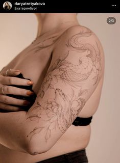 a woman's arm with tattoos on it