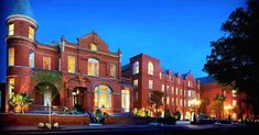 a large red brick building lit up at night