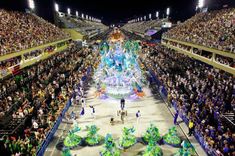 a large group of people standing on top of a stage in front of a crowd