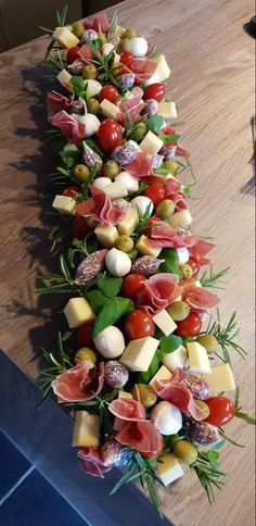 a long platter filled with lots of different types of food