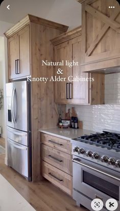 a kitchen with wooden cabinets and stainless steel stove top oven in the center is an appliance that says natural light & ivoryy adier cabinets