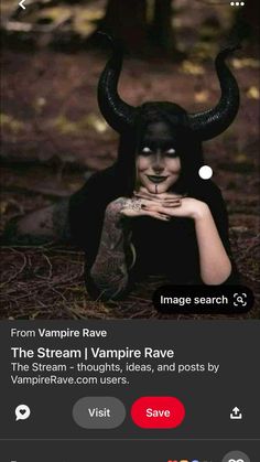 a woman with black makeup and horns on her face is sitting in front of an image search