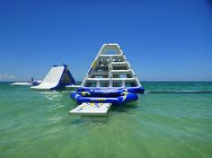 an inflatable water slide is floating on the ocean