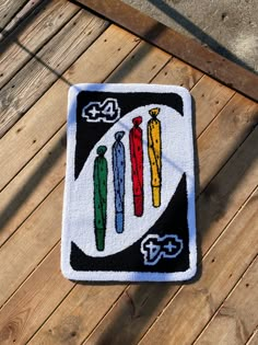 a patch with three different colored crayons on it