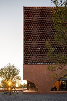 the building is made out of bricks and has an intricate lattice design on it's side