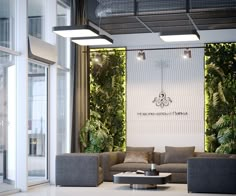 a living room with couches, tables and plants on the wall in front of it