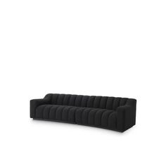 a black couch sitting on top of a white floor