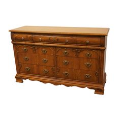 an old wooden dresser with many drawers