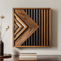 square or rectangular made of light and dark wood tones. It features a geometric design with interlocking shapes that create a three-dimensional effect. This type of wall art is a popular choice for modern and contemporary homes, as it adds a touch of sophistication and style. all dimensions are in inches Modern Geometric Wall Art, Diy Wooden Wall Art, Diy Wood Art Wall Decor, Diy Wood Wall Art, Lath Art, Interlocking Shapes, Geometric Wood Art, Modern Wood Wall Art, Geometric Wood Wall Art