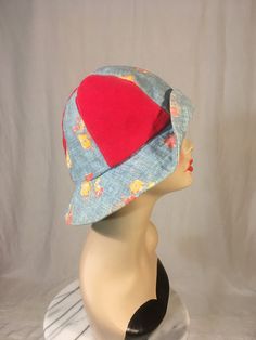 "vintage 1960s bucket hat label- Frantic Frenzi of California clothe red canvas and light blue cloth w/floral print lined w/synthetic light blue fabric good vintage condition, light wear 1 lip of brim is sewn back, could be taken out adult size measures, lying flat, hat band width-11 1/2\" (doubled for total_ brim-2 3/4\" head from top to head band-6 1/2\" All sales final, no returns/exchanges. Please contact with any questions you may have prior to purchase and we will gladly answer them." Vintage Cotton Hat, One Size Fits Most, Vintage Cotton Hat One Size Fits Most, Vintage 5-panel Hat For Spring, Retro Red Summer Hats, Red Retro 5-panel Hat, Retro Red 5-panel Hat, Vintage Red Cotton Hat, Vintage Cotton Hat With Curved Brim, Red Vintage Cotton Hat