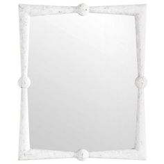 a white square mirror on a white wall